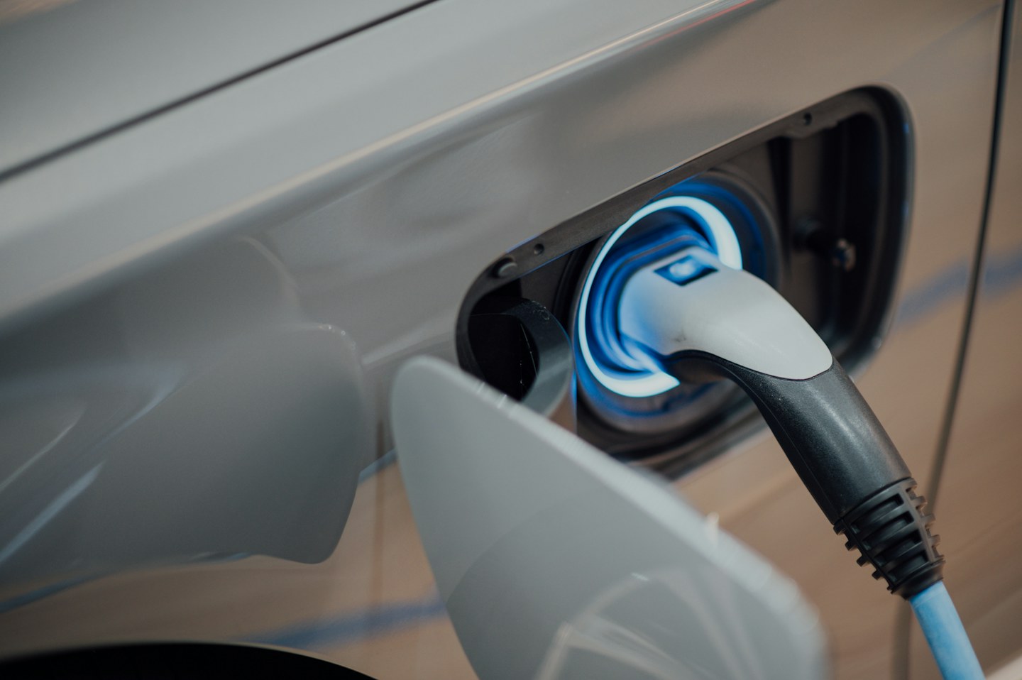 Charging connector attached to an electric vehicle